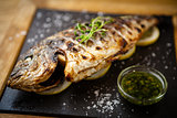 Grilled dorada fish with lemon and spinach