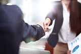 Close up view of business partnership handshake concept.Photo of two businessman handshaking process.Successful deal after great meeting.