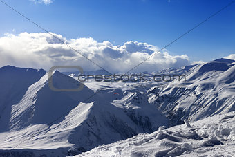 Speed flying in sunny winter mountains