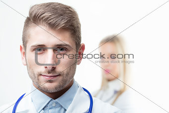 Doctor with stethoscope around his neck smiling at the camera