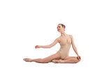 young pretty ballet dancer sitting in elegant pose