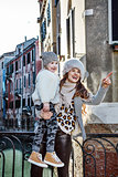 happy mother and child travellers in Venice, Italy sightseeing