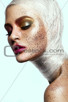 Close up of woman face with glitter on face