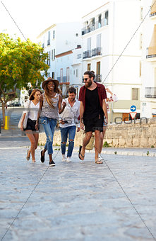 Young adult friends exploring in Ibiza, Spain, vertical