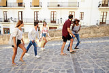 Young adult friends on holiday walking in Ibiza, Spain