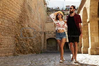Couple sightseeing old buildings on vacation, Ibiza, Spain