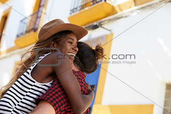 Happy couple embracing in the street, close up, Ibiza, Spain