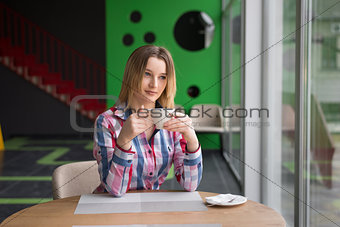 girl in cafe drinking coffee