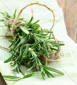 Fresh organic rosemary on a wooden table