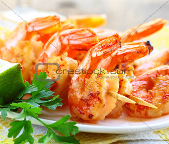 fried shrimp on skewers with herbs and spices