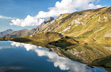 sky reflected in alpine lake