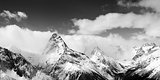 Black and white panoramic view on winter mountains in snow