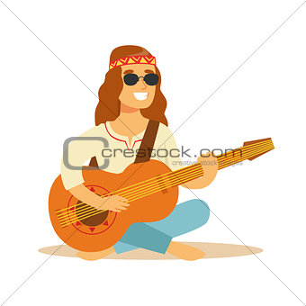 Man Hippie Dressed In Classic Woodstock Sixties Hippy Subculture Clothes Sitting Playing Guitar In Round Shades