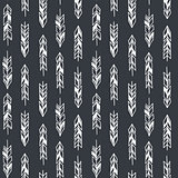 Seamless hand drawn geometric tribal pattern with feathers. Vector navajo design.