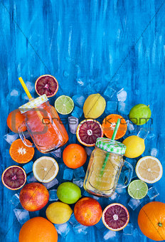 Citrus vitamin juice with fresh fruits around