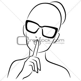 Girl in glasses gesticulated with her finger at lips