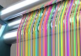 Textile machine with rainbow colors threads. 3d illustration