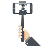 Hand with smartphone on selfie stick