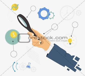 Human hand holding magnifying glass