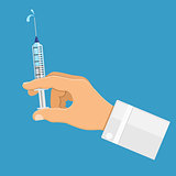 Doctor holding syringe in hand