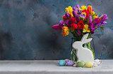 Spring flowers with easter rabbit and eggs