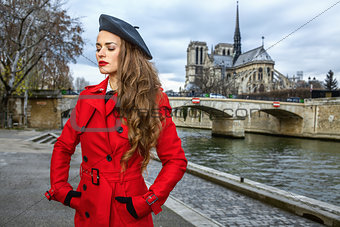 traveller woman on embankment near Notre Dame de Paris