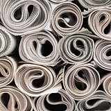 Rolls of newspapers.