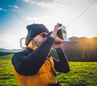 Nature photographer tourist in mountains