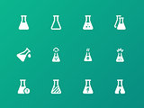 Pharmacology flask icons on green background.