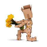 Boxman on bended knee with flowers