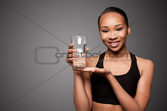 Happy healthy black asian woman with water