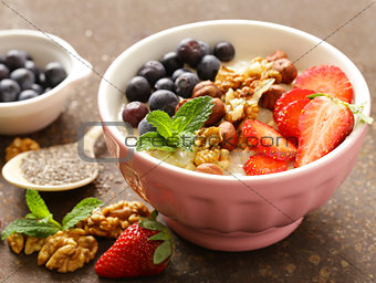 Oatmeal porridge with nuts and berries for a healthy breakfast