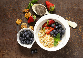 Breakfast cereals, granola with strawberries and blueberries