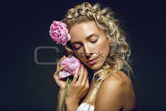 Beautiful girl with peony flower