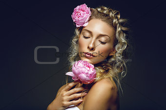 Beautiful girl with peony flower