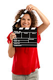 Happy mature woman holding a clapboard