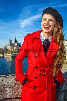 traveller woman on embankment in Paris looking into the distance