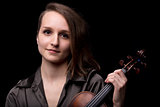 young woman violinist portrait on black