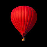 Red air balloon isolated on black