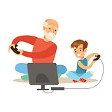 Grandfather And Boy Playing Video Games, Part Of Grandparents Having Fun With Grandchildren Series