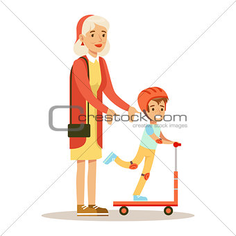 Grandmother Teaching Boy To Ride Scooter, Part Of Grandparents Having Fun With Grandchildren Series