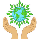 Green Earth planet in human hands 