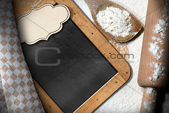 Empty Blackboard with Flour and Rolling Pin