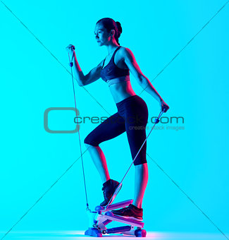 woman exercsing Stepper fitness exercices isolated