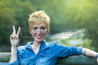 v-sign in the mountain by a young woman