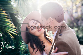 Young elegant fashion couple smiling in park