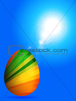 Striped Easter egg over sunny blue sky