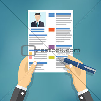 Hands of businessman fill a resume.