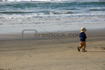 Boy Walking on the Beach