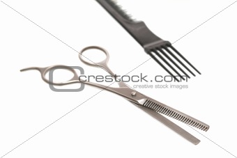One scissors for a hairstyle on a white background